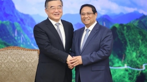 Thủ tướng Teh đak Phạm Minh Chính sơng pơma dơnuh hăm Kơ iĕng Kơdră chĕp pơgơ̆r Kuô̆k hô̆i Trung Quốc Trương Khánh Vĩ.