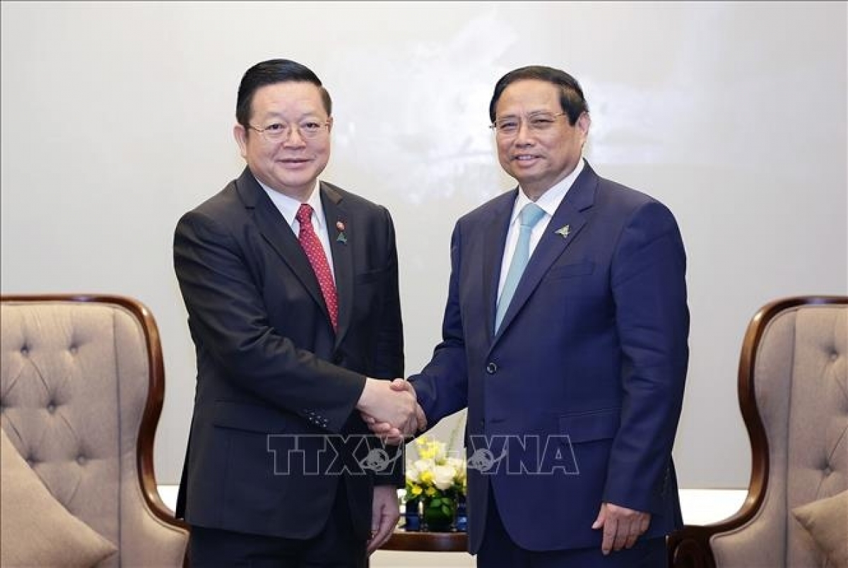 Thủ tướng Phạm Minh Chính sơng Tổng Thư ký ASEAN Kao Kim Hourn. Rup: TTXVN